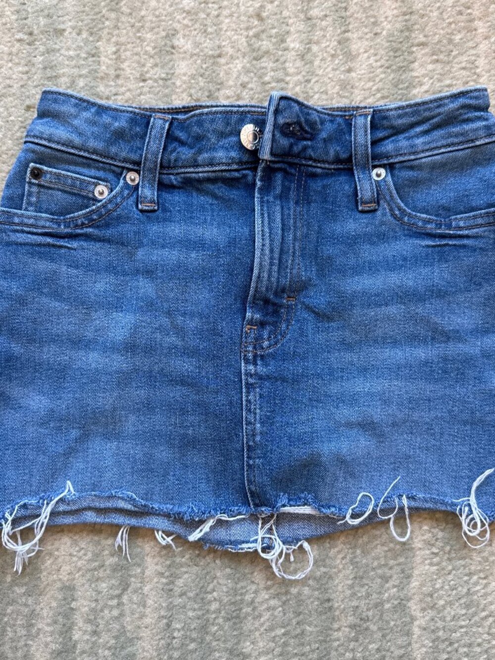 Y2K blue denim mini skirt with frayed hem